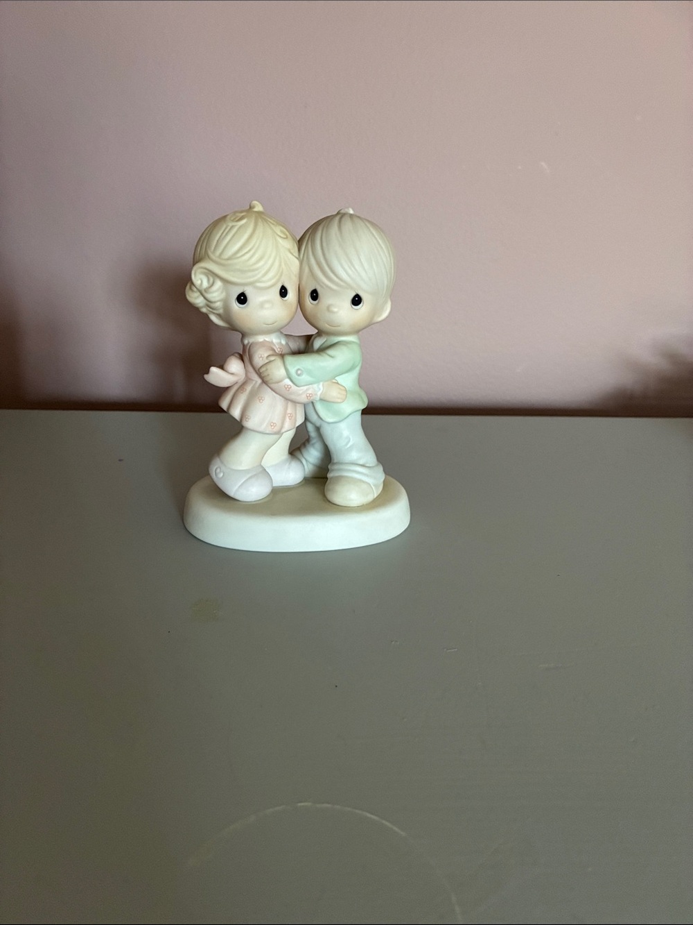 Precious moments hug one another
